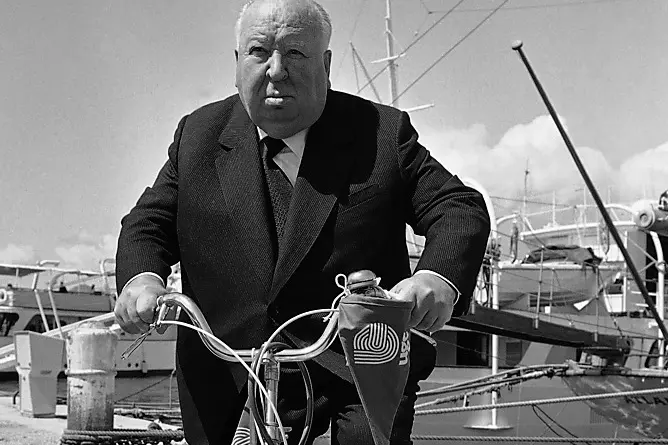 In this May 15, 1972 file photo Master of suspense film director Alfred Hitchcock pedals his bicycle to the Cannes international film festival in Cannes, France. (AP Photo, File) , AP